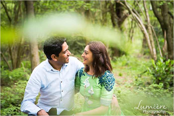 asian couple at pre-wedding photography session in Loughborough's woods
