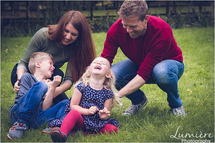 family photography in leicester Parents tickling children