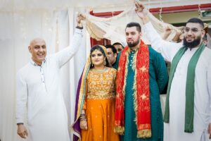 Mehndi ceremony bride and groom entrance at Caplow Center in Leicester